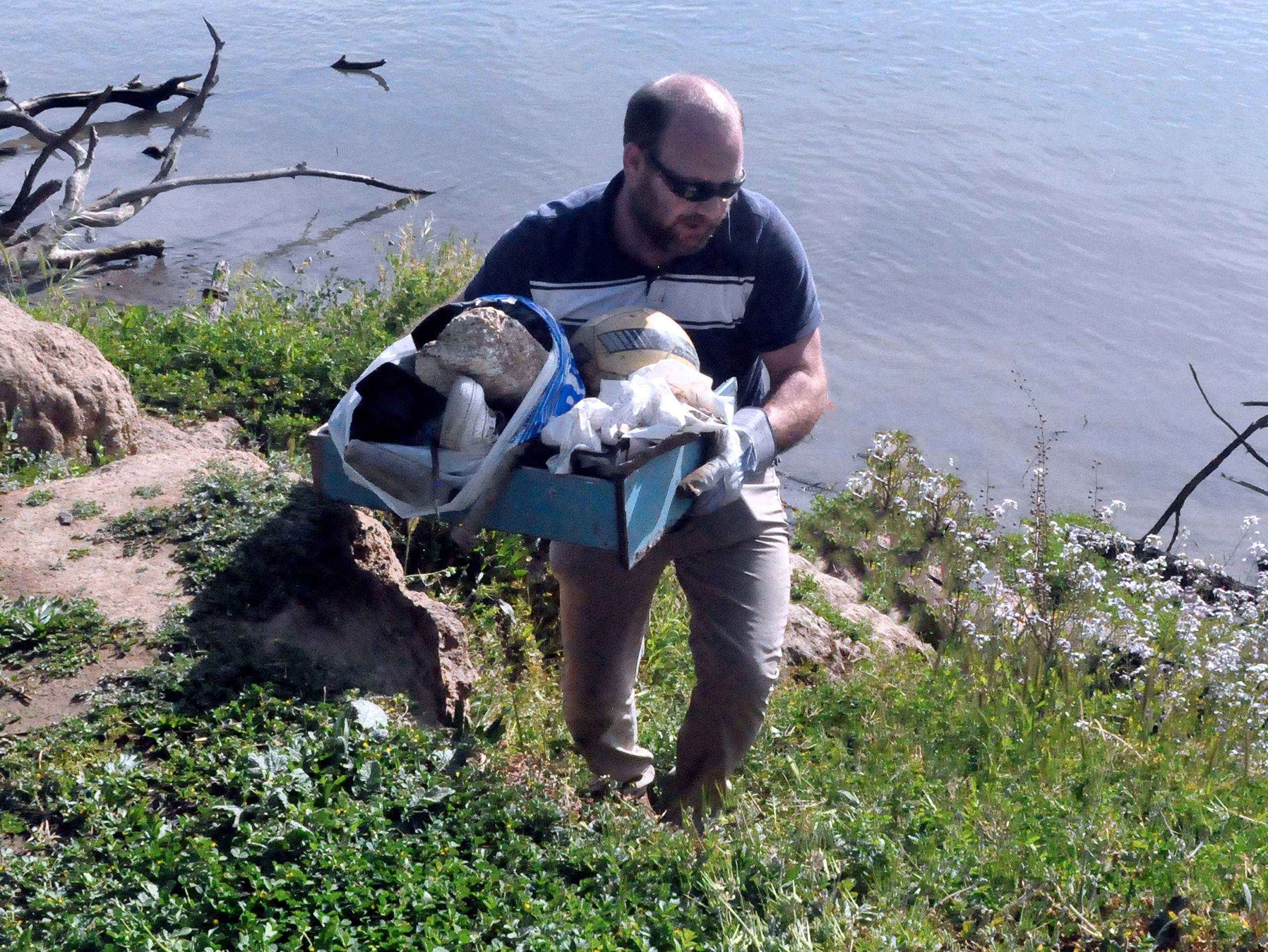 CTS CEO Bobby Reed cleaning trash