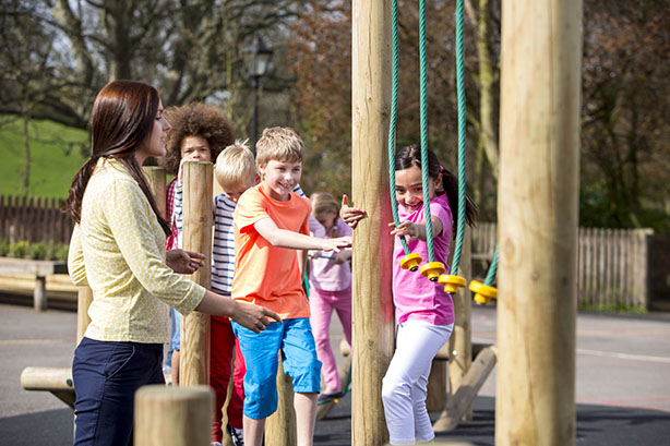 Photo of students playing on a playground