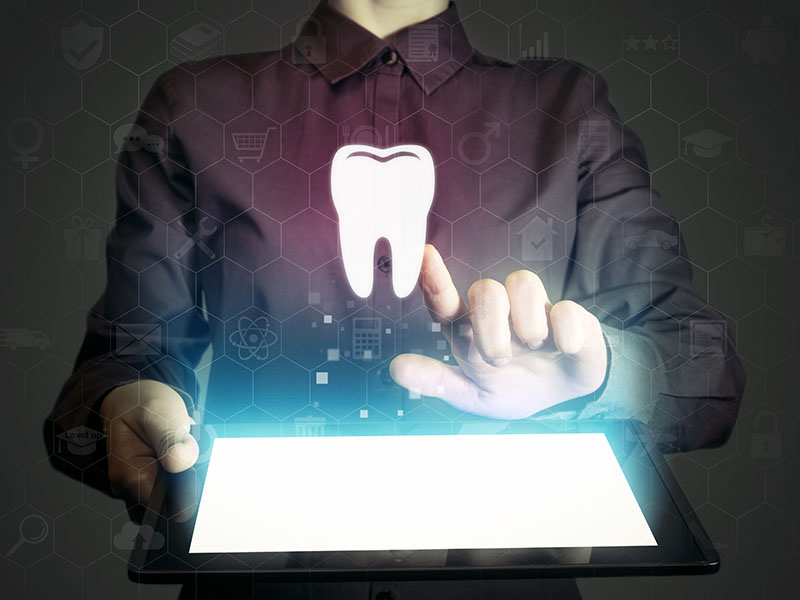 Photo of a man using dental marketing services.