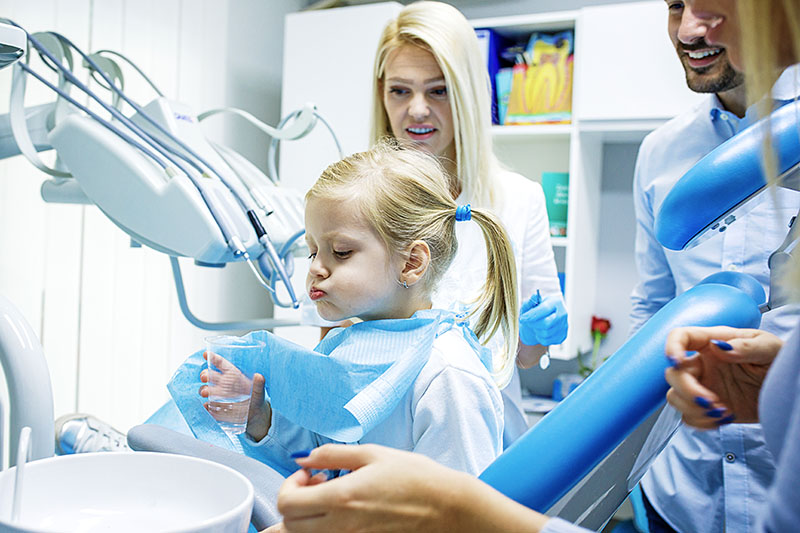 Photo of a family in a dental office.