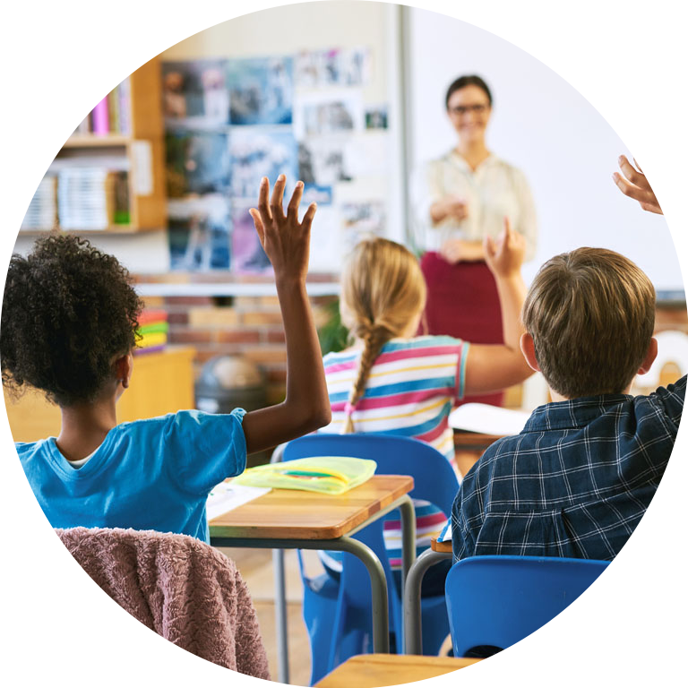 Student rising hands to answer questions from teacher