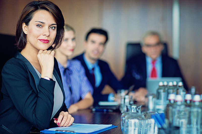 Photo of a team of attorneys at a law firm in a meeting.