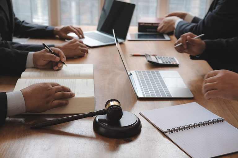 Lawyers sitting around table