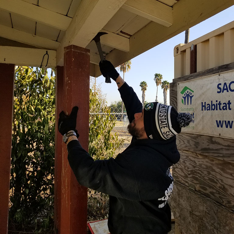 Robert Haney hammering the ceiling