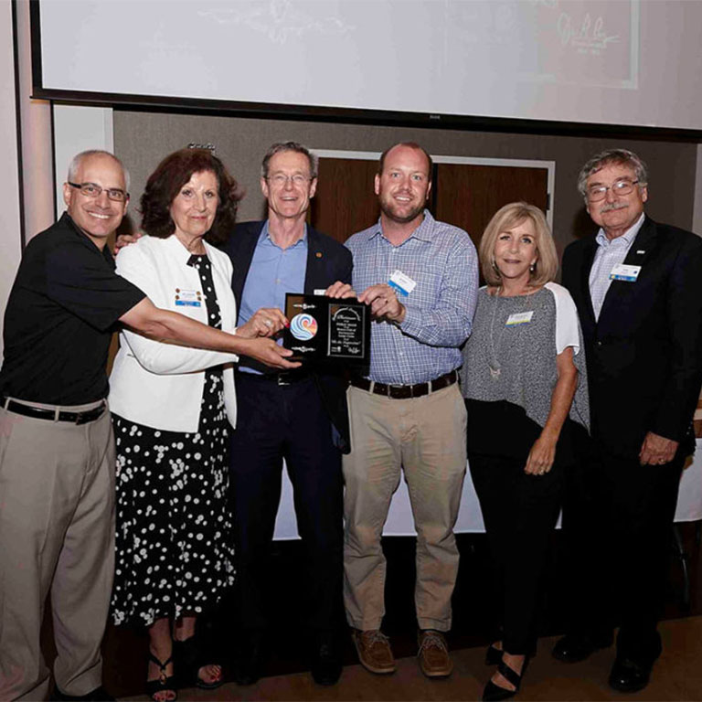 Bobby with Rotary Club accepting a public image award