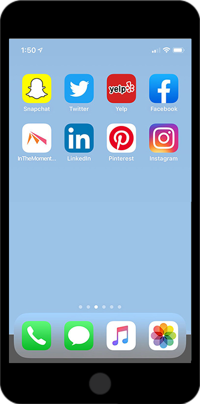 Photo of an iPhone screen showing social media apps